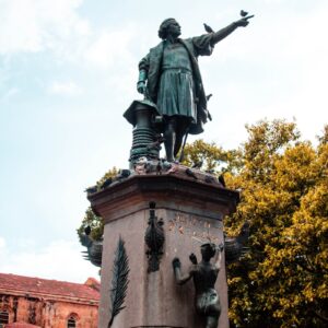 a statue of a man with a bird on his arm