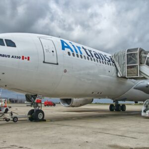 white and blue Air Trans landing during daytime