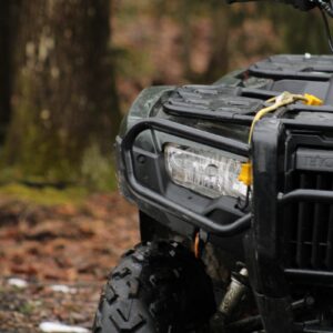 a four wheeler is parked in the woods