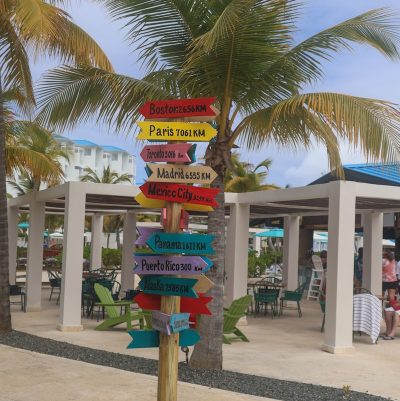 A pole with a bunch of signs on it